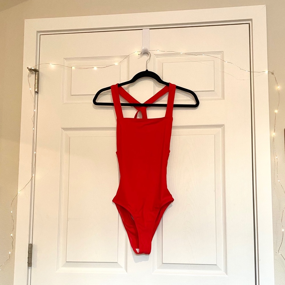 Red one-piece swimsuit with cross back detail